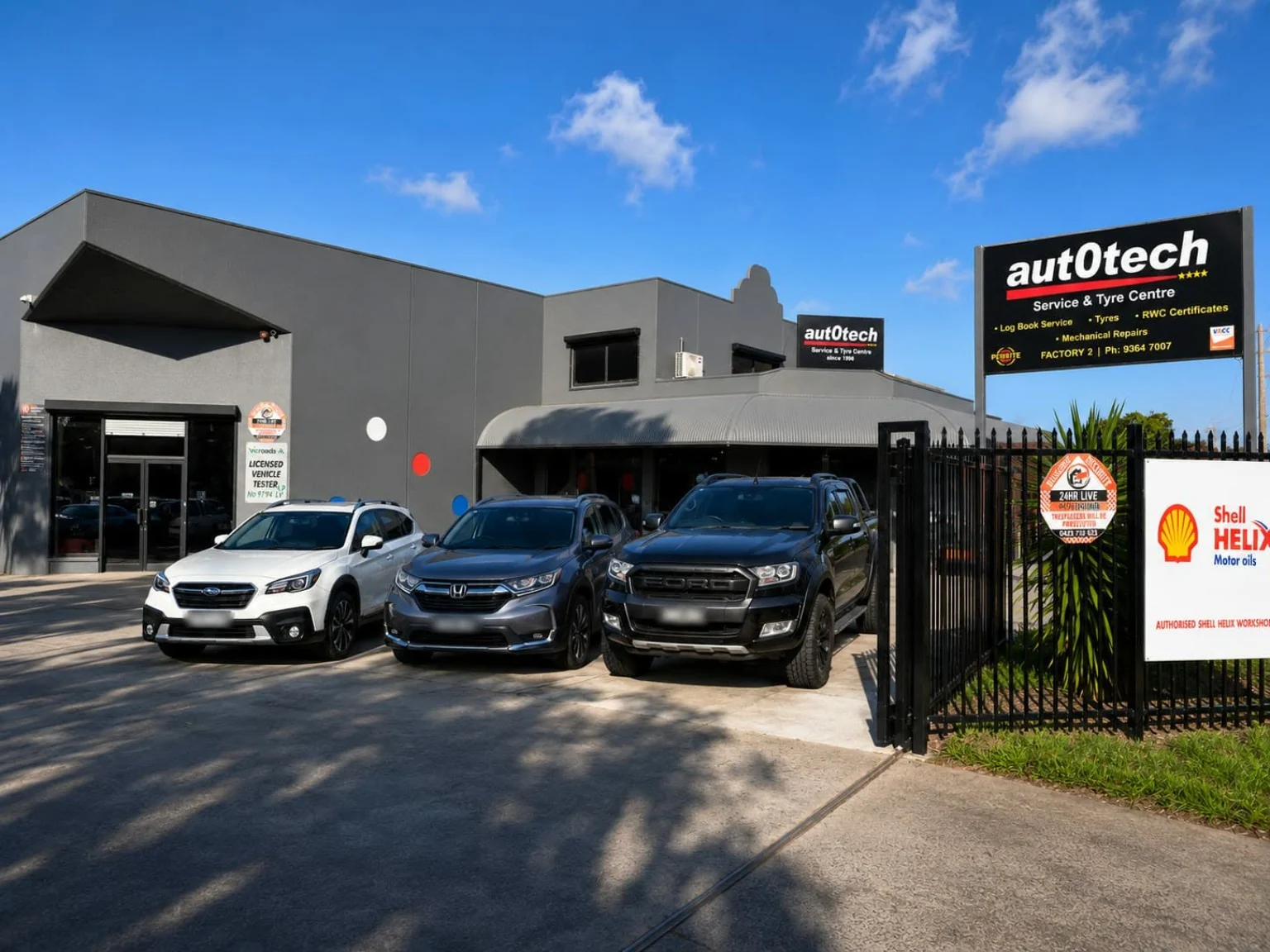 Autotech workshop front in Sunshine West, with parked vehicles and the black roadside Autotech sign